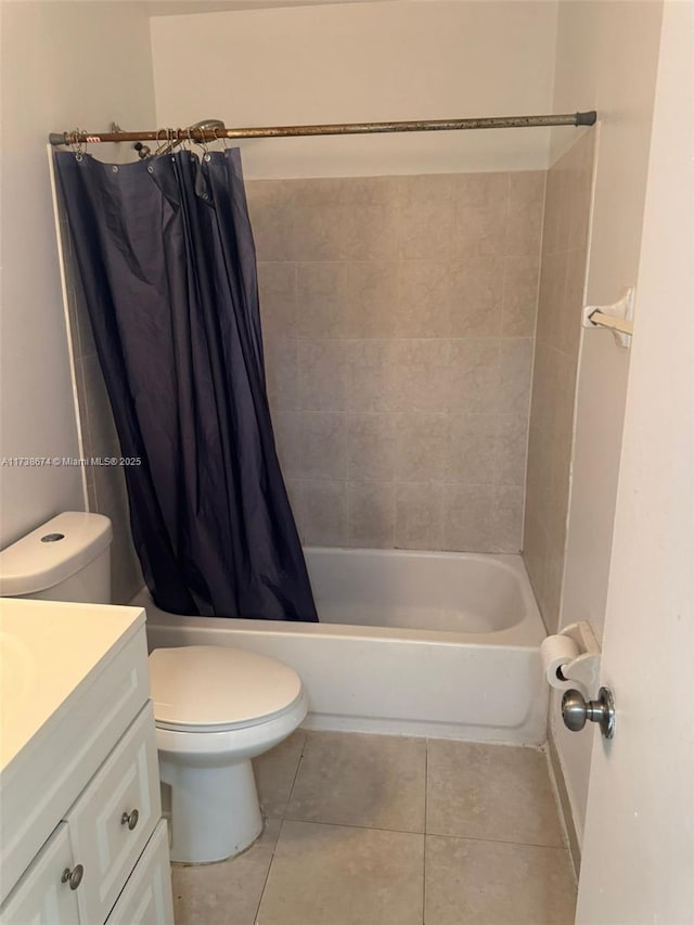 full bathroom featuring tile patterned flooring, vanity, shower / bath combo, and toilet