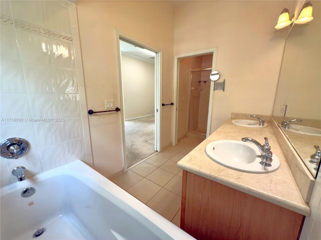 full bathroom featuring double vanity, a sink, and tile patterned floors