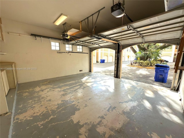 garage featuring a garage door opener