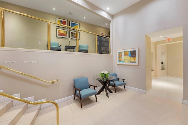 living area featuring tile patterned floors