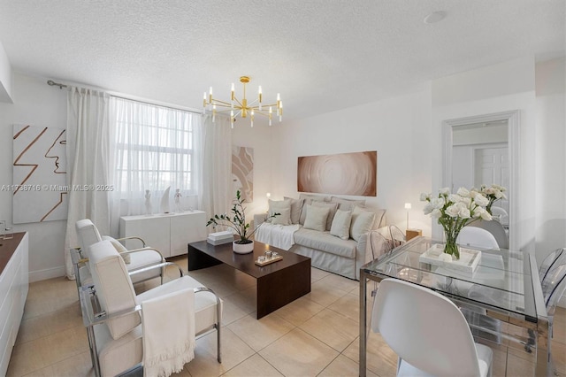 living room with light tile patterned floors, a textured ceiling, and a notable chandelier