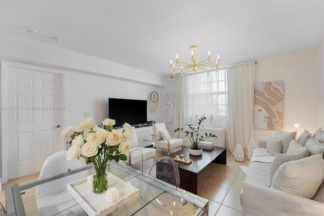 tiled living room with an inviting chandelier and a textured ceiling