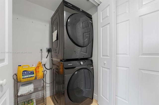 laundry room featuring stacked washer and clothes dryer