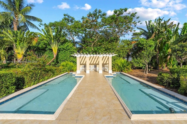 view of swimming pool with an outdoor structure