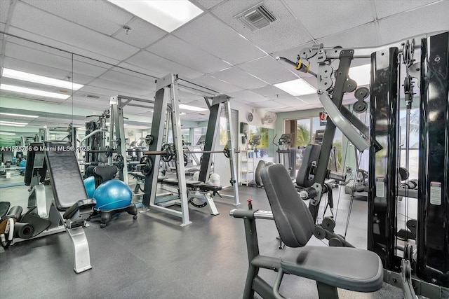 exercise room featuring a paneled ceiling