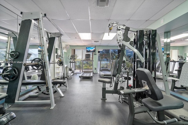 workout area featuring a drop ceiling