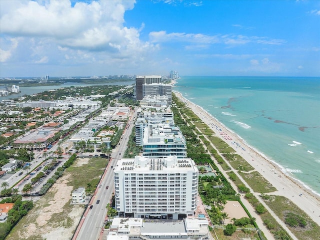 birds eye view of property featuring a view of the beach and a water view