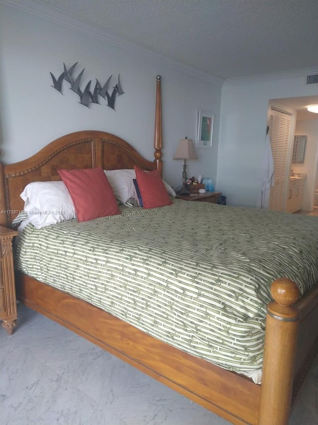 bedroom with crown molding and a textured ceiling