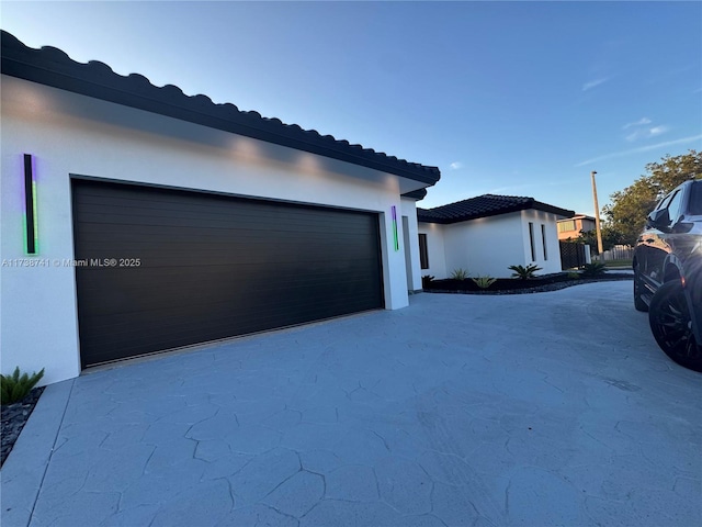 view of side of property with a garage