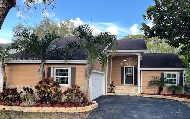 ranch-style home with a garage