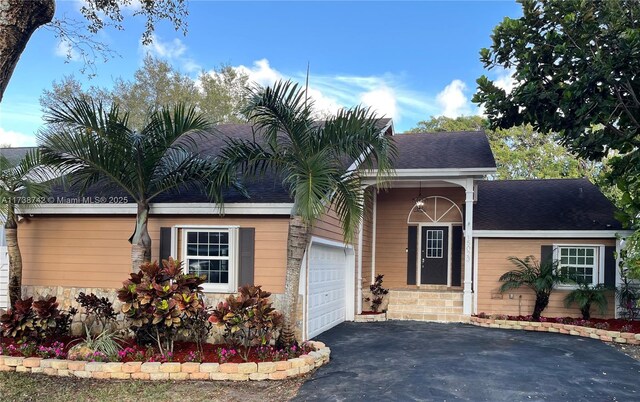 single story home with a garage