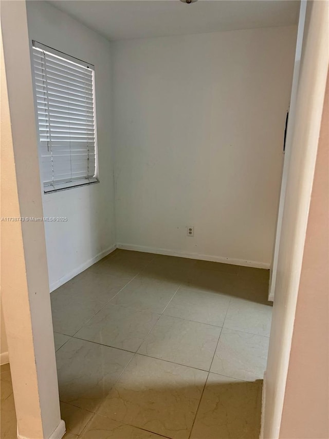 empty room with light tile patterned floors