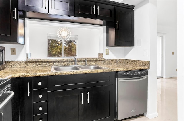 kitchen with sink, dishwasher, range, and light stone countertops