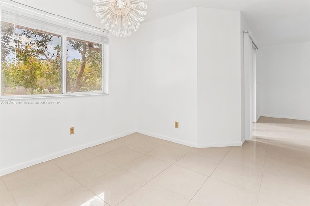 unfurnished room featuring light tile patterned floors and a chandelier