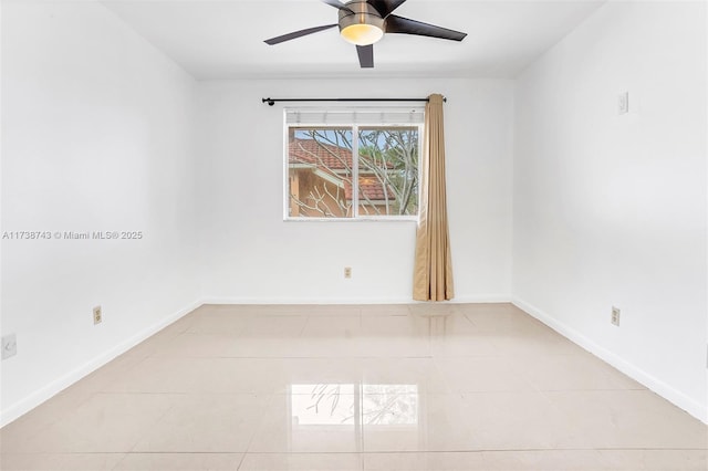 tiled spare room featuring ceiling fan