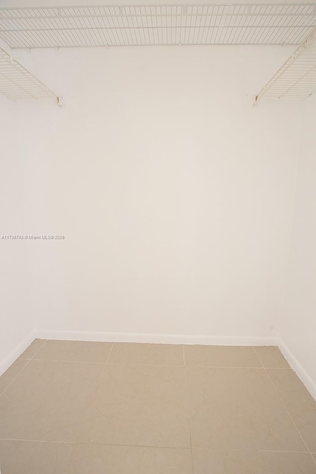 walk in closet featuring tile patterned floors