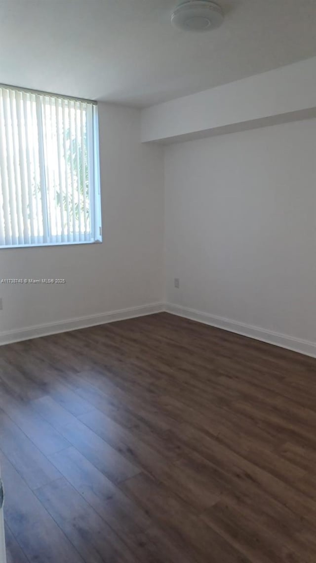 510 NW 84th Ave Unit 518, Plantation, FL 33324 - unfurnished room featuring dark wood-style floors and baseboards