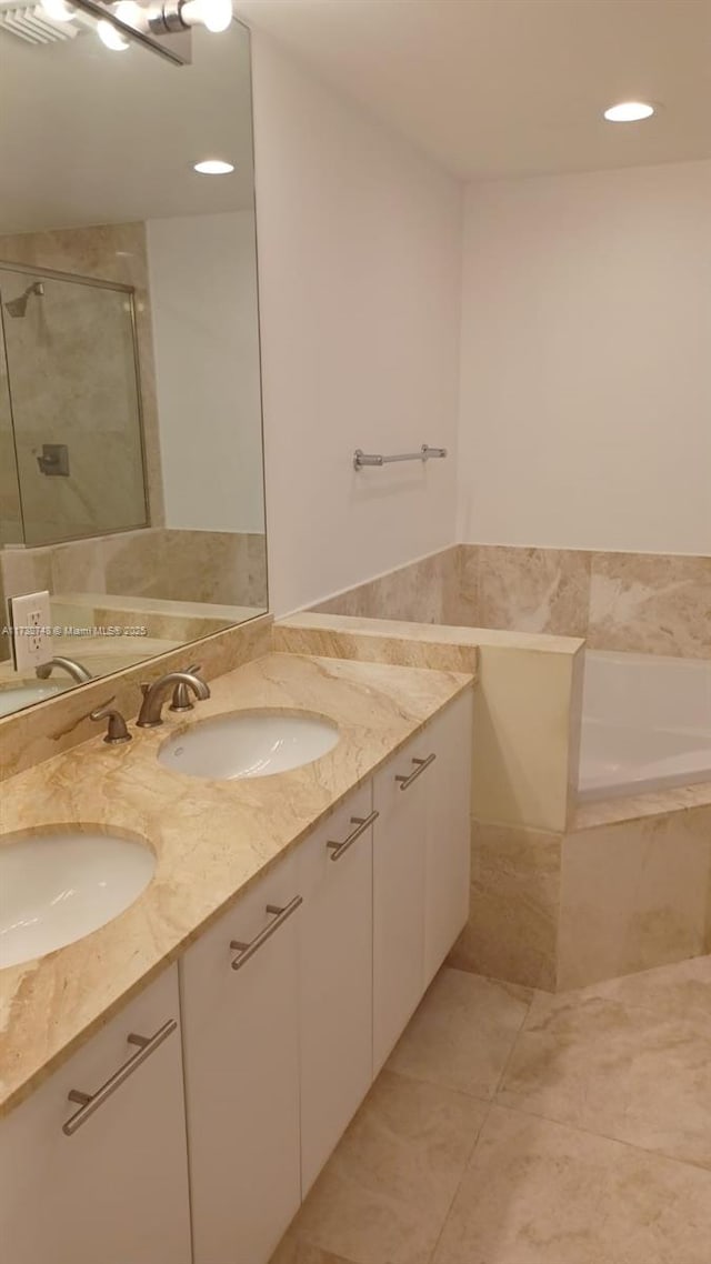 510 NW 84th Ave Unit 518, Plantation, FL 33324 - bathroom with a garden tub, a sink, a shower stall, and double vanity