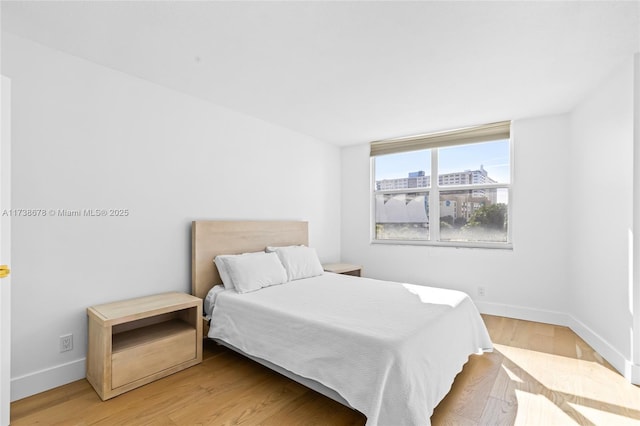 bedroom featuring hardwood / wood-style flooring