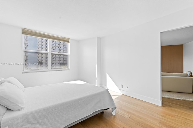 bedroom featuring wood-type flooring