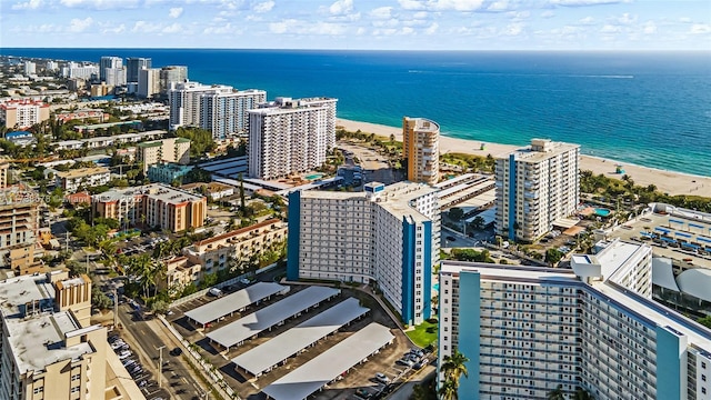 birds eye view of property with a view of the beach and a water view