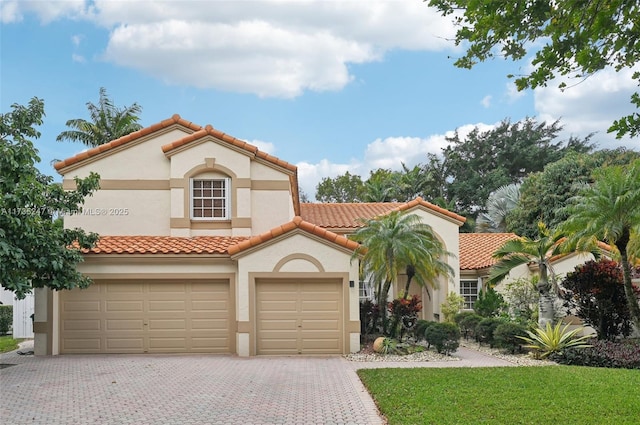 mediterranean / spanish-style home featuring a garage