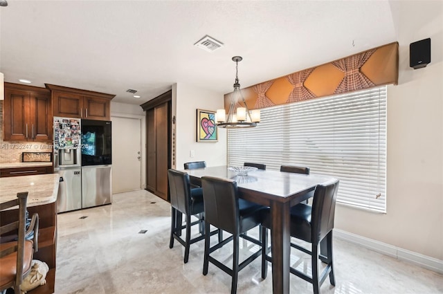 dining room with a chandelier