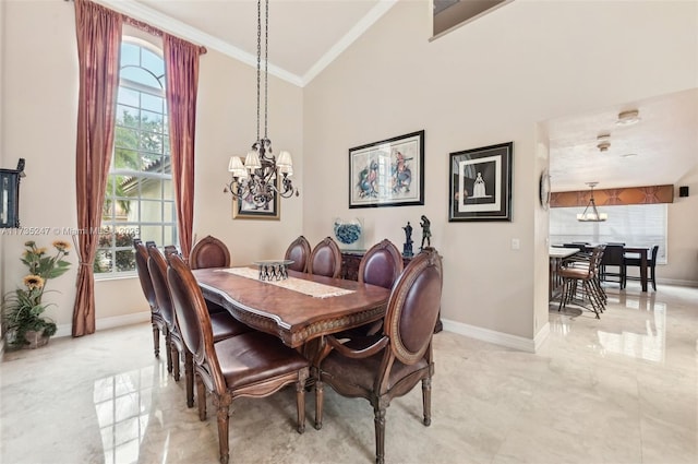 dining space with crown molding, high vaulted ceiling, and a notable chandelier