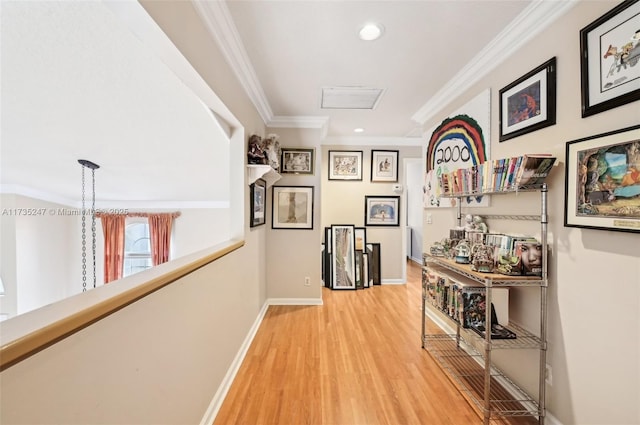 corridor with crown molding and light hardwood / wood-style floors