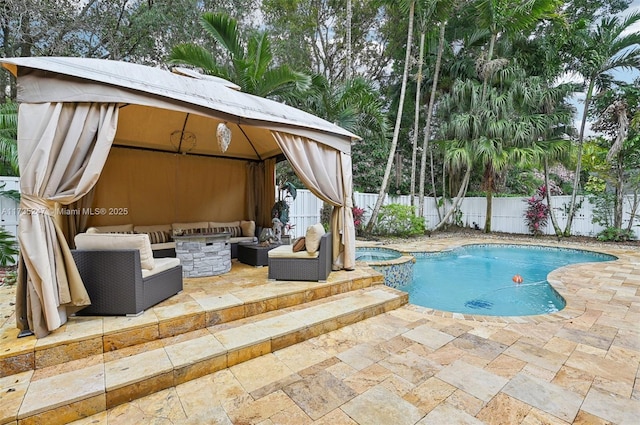 view of swimming pool featuring an in ground hot tub, a gazebo, an outdoor hangout area, and a patio