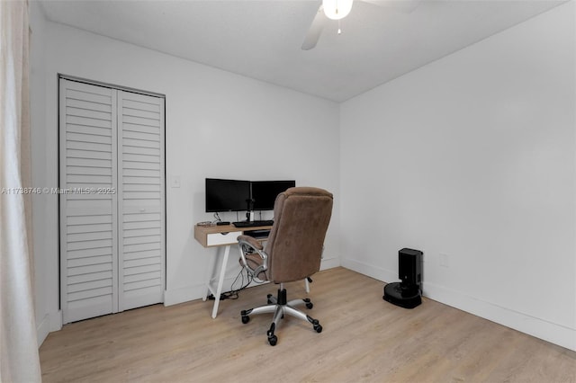 home office with ceiling fan and light wood-type flooring