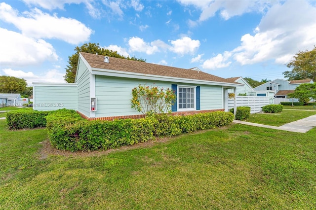 view of property exterior with a lawn