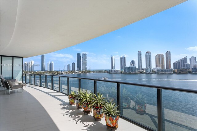 balcony featuring a water view