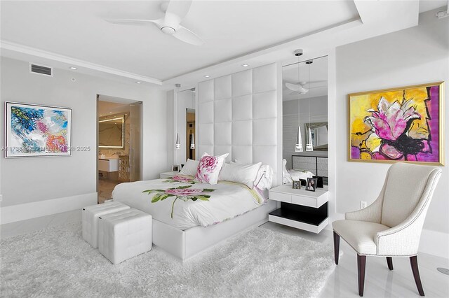 bedroom featuring ensuite bathroom and ceiling fan