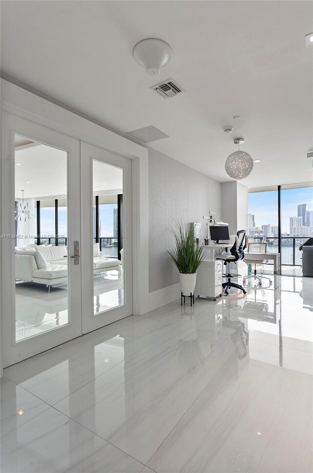 home office with french doors and floor to ceiling windows