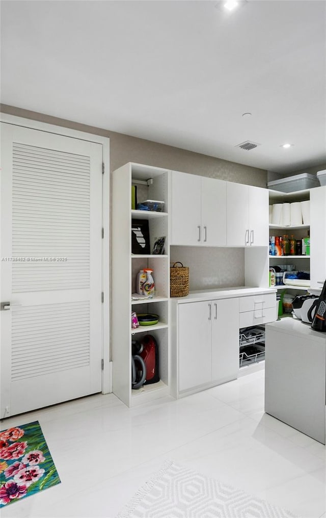 kitchen featuring white cabinetry