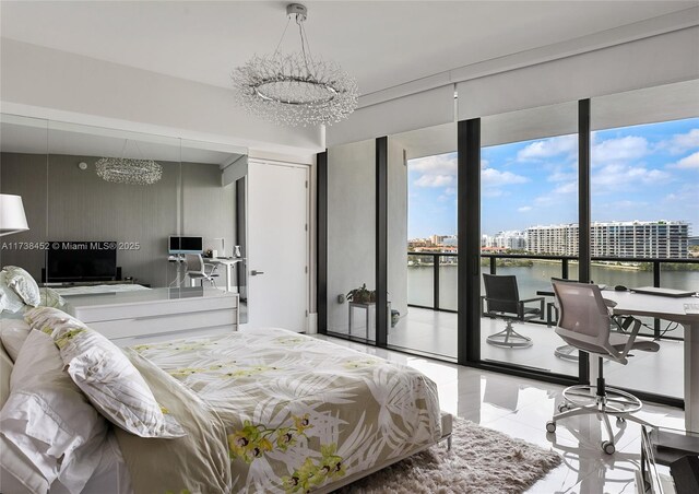 tiled bedroom with access to exterior and a chandelier