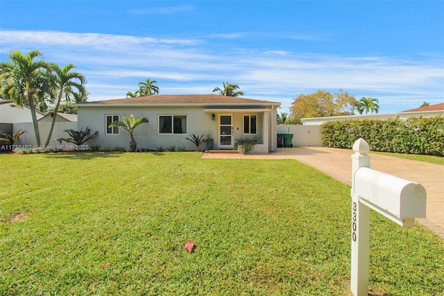 ranch-style house featuring a front lawn