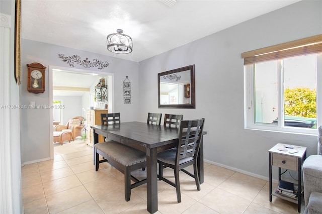 dining space with light tile patterned flooring