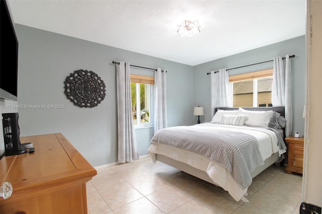 bedroom featuring light tile patterned floors