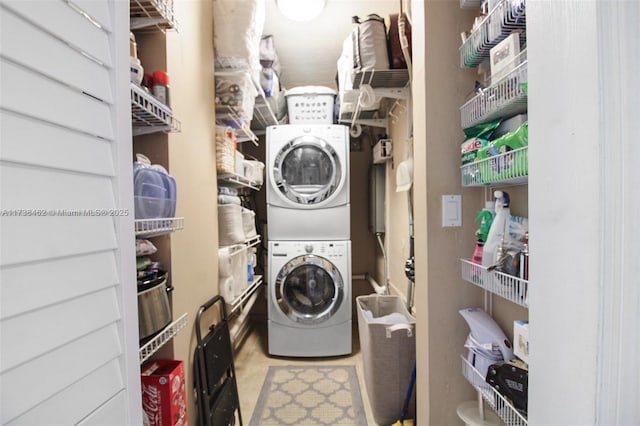 washroom with stacked washer and clothes dryer