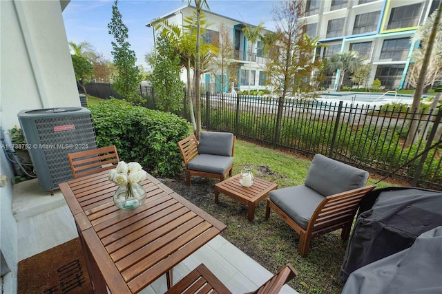 view of patio / terrace with cooling unit and a community pool