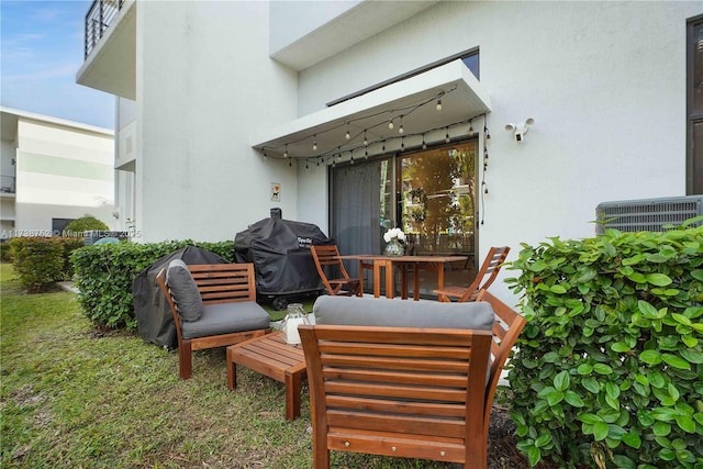 view of patio with an outdoor living space, a grill, and central AC