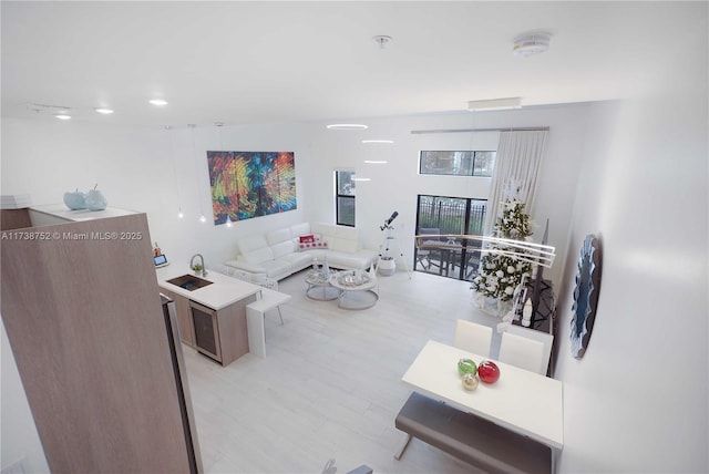 living room with light hardwood / wood-style flooring