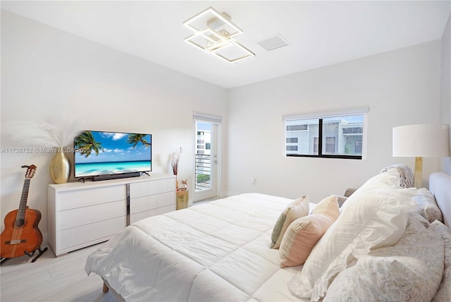 bedroom with light hardwood / wood-style flooring