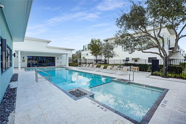 view of swimming pool with a patio area