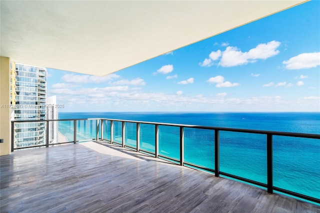 balcony featuring a water view