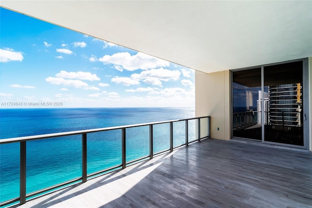 balcony featuring a water view