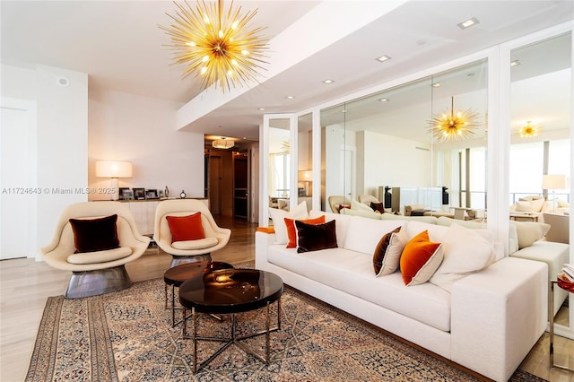 living room with hardwood / wood-style flooring and a chandelier