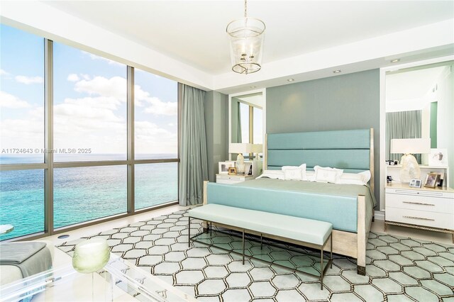 bedroom featuring a water view